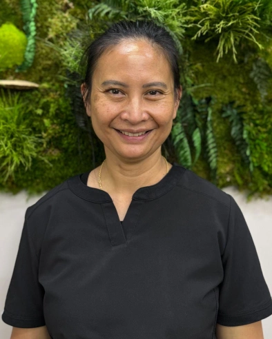 Jojo Linsagan, Certified Dental Assistant at Kanata dental practice, smiling at camera.