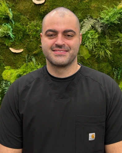 Juliano Bortelho, dental team member at Kanata dental practice, smiling for team photo.