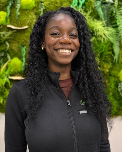 Peace Lubangi, Treatment and Hygiene Coordinator, smiles at Kanata dental practice.