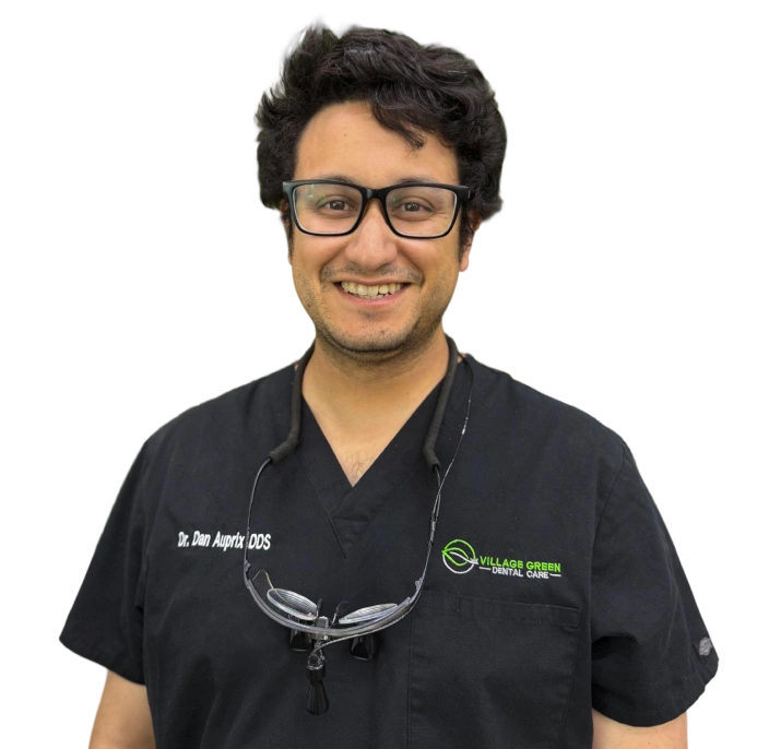Dr. Dan Auprix, DDS, smiling in professional dental attire at Village Green Dental Care in Kanata.