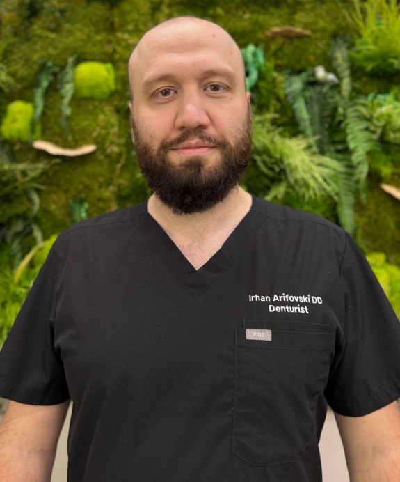 Irhan Arifovski, DD dentist, in professional black scrubs at Kanata dental practice.