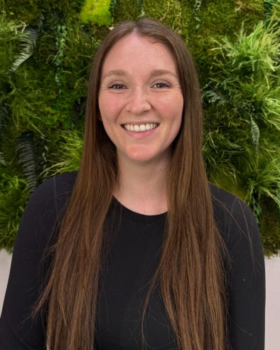 Mackenzie Bray, dental team member at Kanata dental practice, smiling at camera.