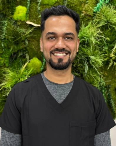 Rajat Asija, dental team member at Kanata dental practice, smiling at camera.