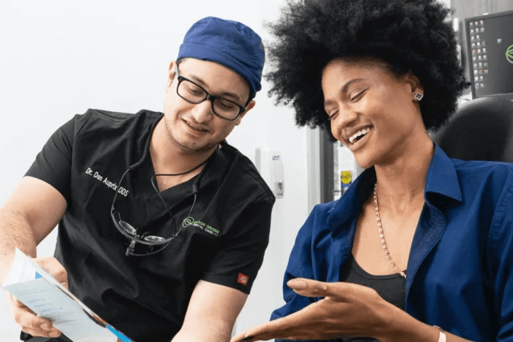 Village Green Dentist speaking with a patient