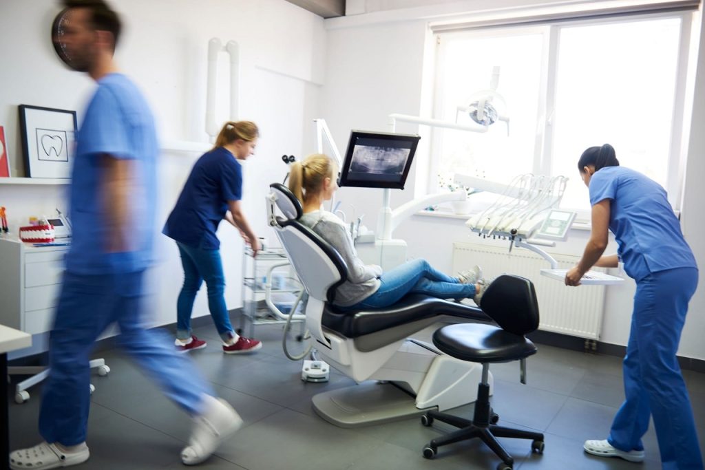 Dental team preparing for an emergency dental procedure